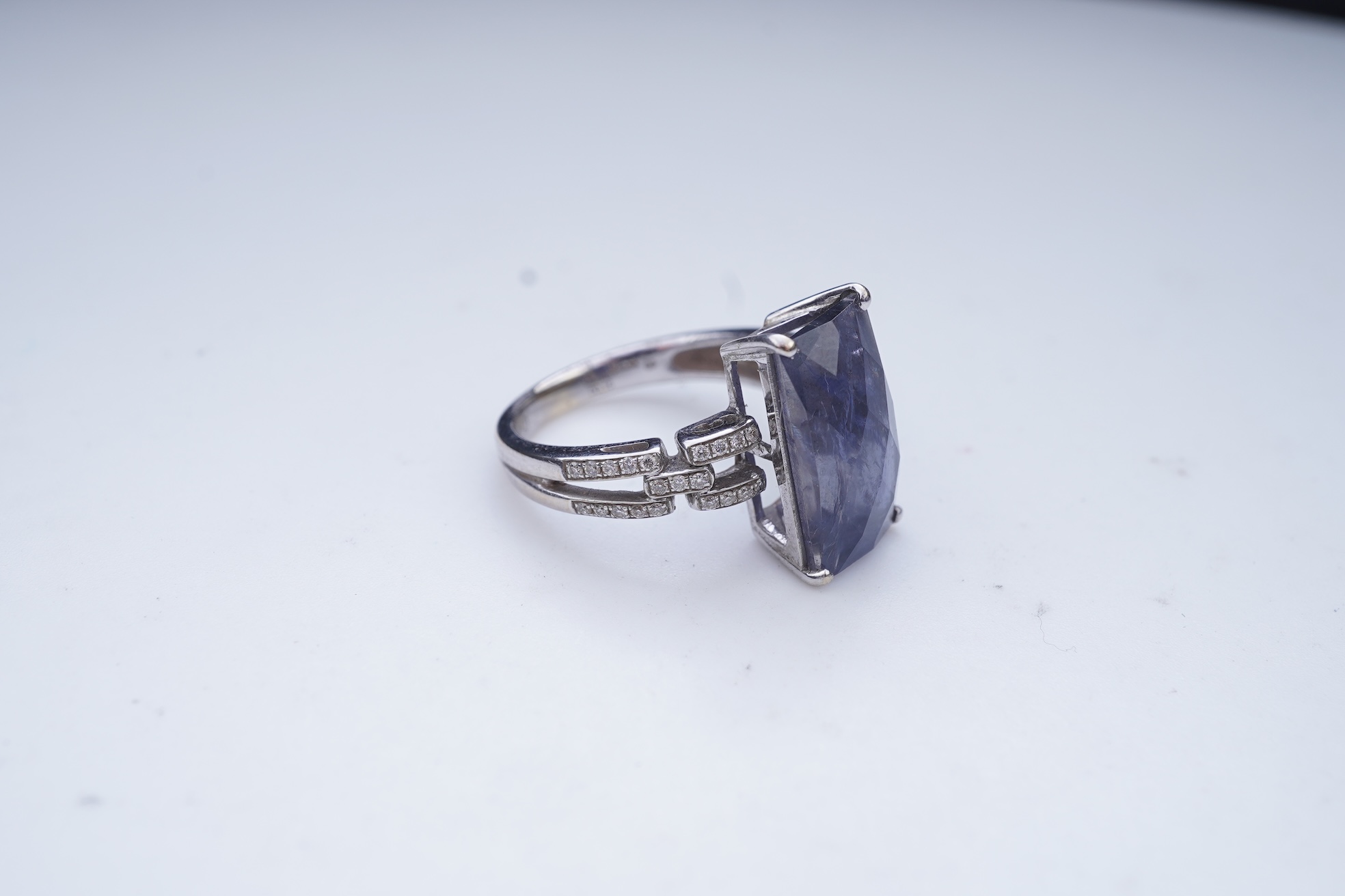 An iolite and diamond ring
